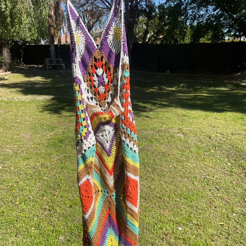 A beautiful halter maxi crocheted dress never been worn in perfect condition